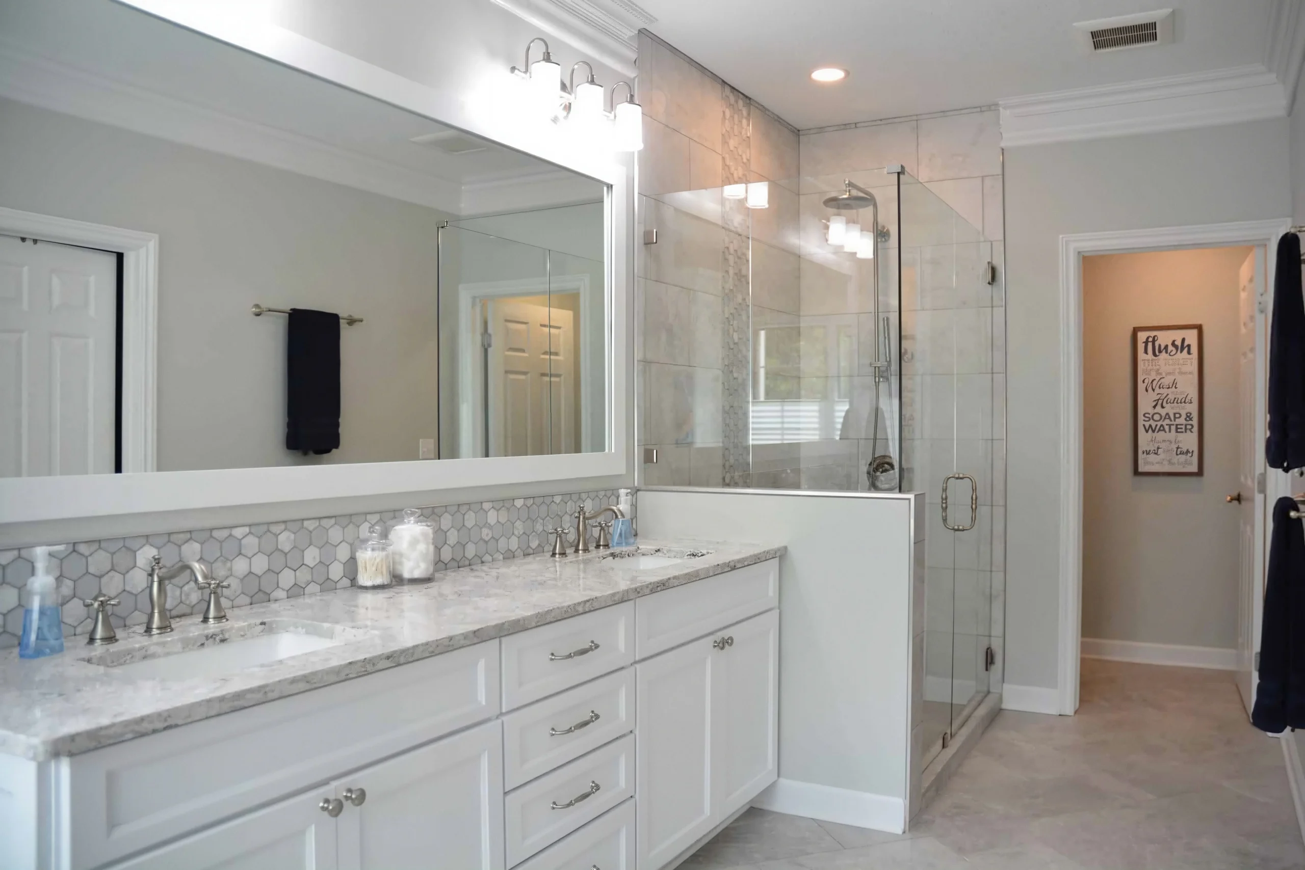 Bright remodeled bathroom designed by McDaniels Kitchen and Bath
