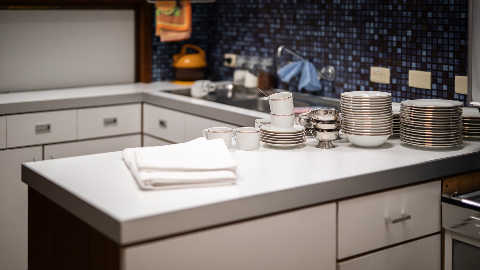 Close-up of a kitchen countertop edge and drop-in sink rim